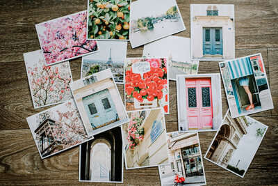 assortment of paris postcards featuring the eiffel tower, seine river, paris florists, the louvre museum, and paris doors