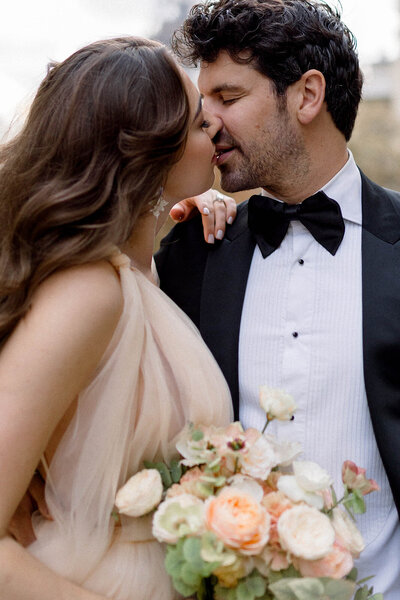 engagement session couture couple in Paris kissing