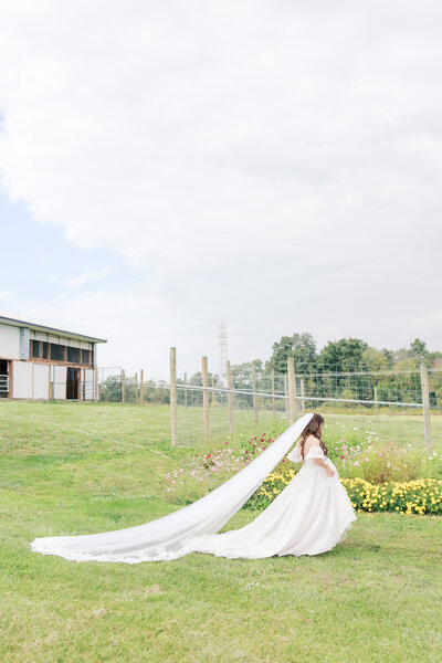Bride walking to her first look with her dad
