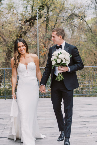 bride and groom have playful moment during wedding day portraits in montgomer, ny