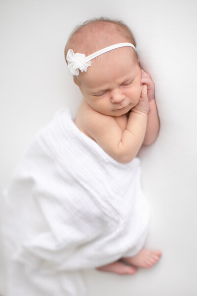 Newborn baby sleeping during photo session with Tiffany Hix Photography at her Boise Photography Studio