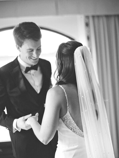 Couple holding hands and looking at each other taken by washington dc wedding photographers