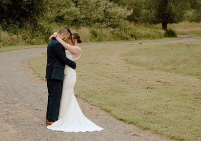 elopement couple embracing at sunset