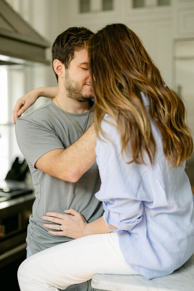 Family Photography in Friendswood Texas. Mom and dad in kitchen- captured by Amy Marie. 