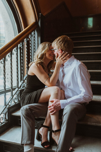 A modern, classy winter engagement session in Minneapolis, Minnesota exploring  the halls of a historical  landmark center