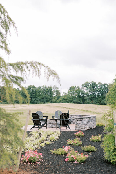 Hazelwood outdoor wedding reception with fire pit and forest views