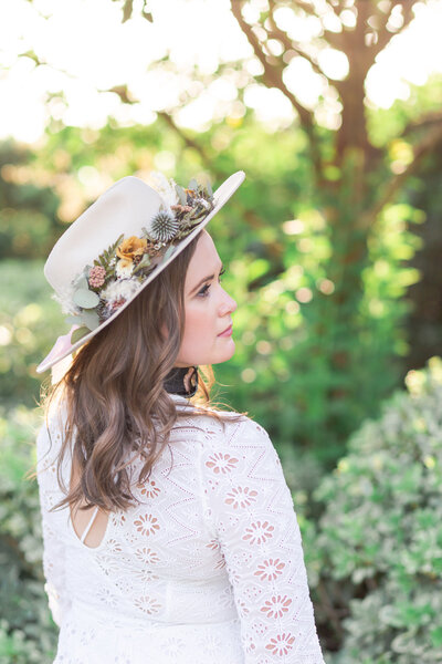 wedding planner Loose Ends Events looks to the side during her branding session at McGovern Centennial Gardens in Houston Texas by Swish and Click Photography