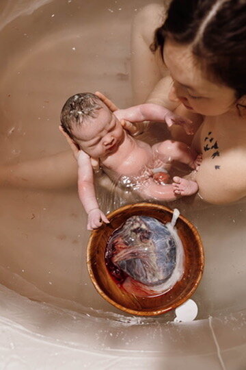 Couple posing in their home during an in home newborn photoshoot