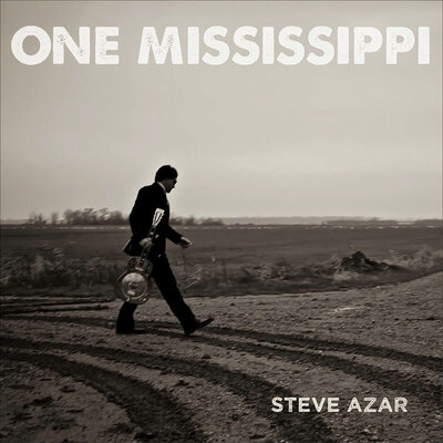 Steve Azar single cover title One Mississippi image of musician walking down crossroads wearing suit and holding guitar black and white