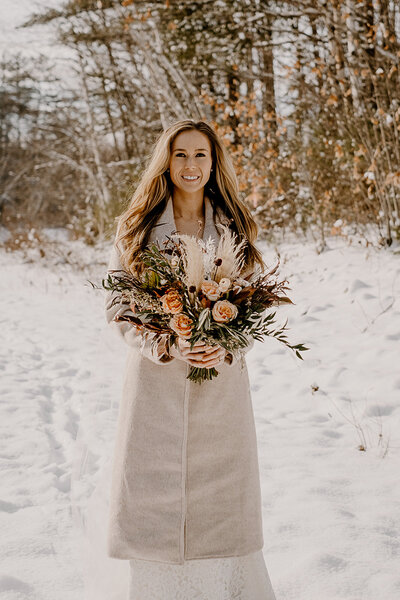bride holding flower bouquet