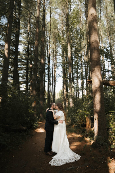 bride and groom wedding dress wedding photo in woods in cumberland maryland at wedding venue at Rocky Gap