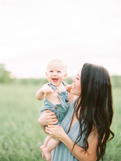 woman and baby smiling