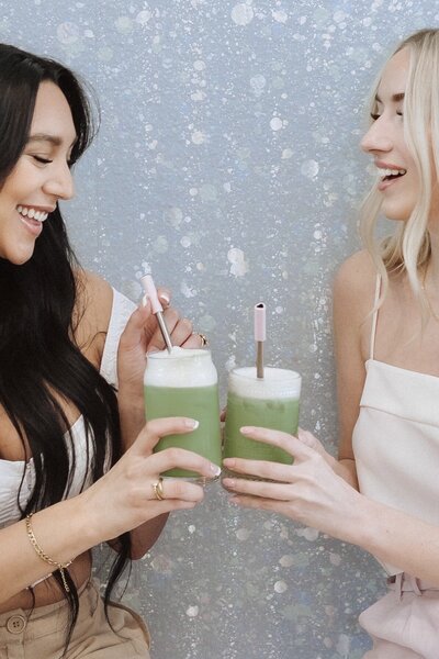 Two women smiling with luna lash matcha refreshers