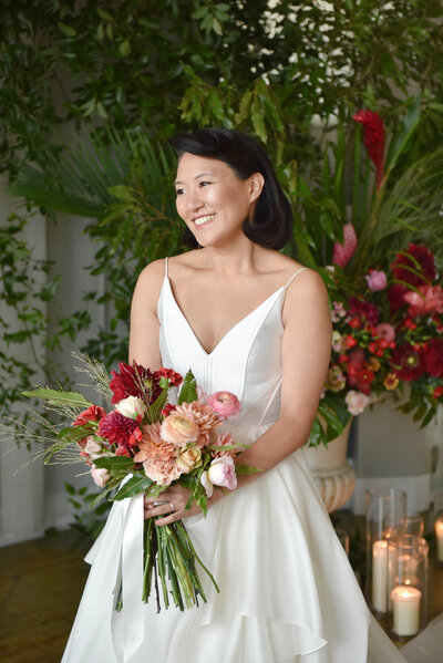 bride with pink and red bouquet, denver colorado wedding photographer