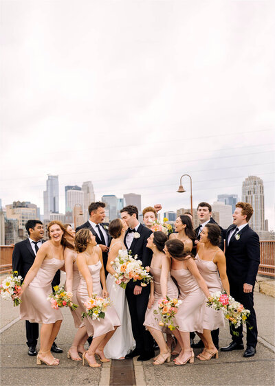 Wedding Couple posing with Minneapolis city background