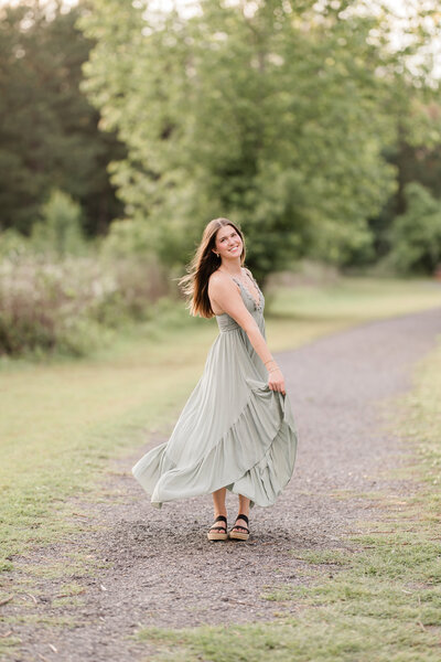 Female on back of sister smiling at the camera.