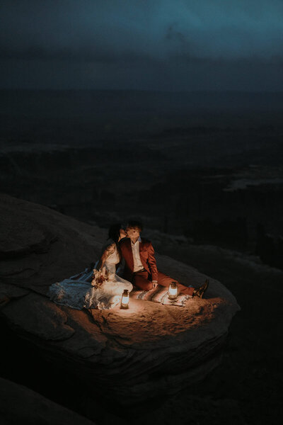 An eloping couple embracing under Latourell Falls in Oregon's Columbia River Gorge.