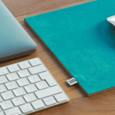 desk with keyboard and mouse pad