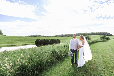 Bride Embraces Groom in Flower Garden in Robin Hill Park Pittsburgh