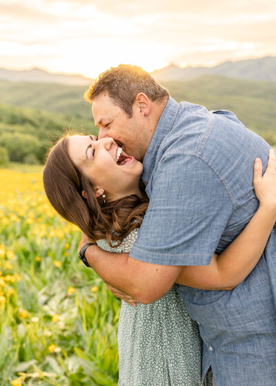 a man and woman embracing in a field