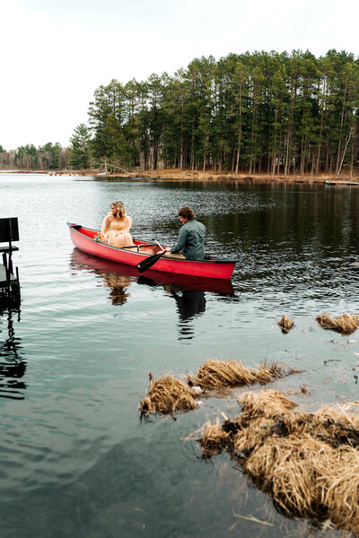Just married couple going canoeing after ceremony