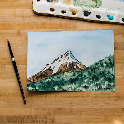 A watercolor painting of Mt Hood in the late summer by Amy Duffy