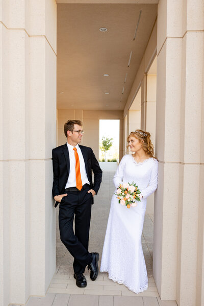 Redheaded bride and brunette groom share a special moment as they gaze into each others eyes.