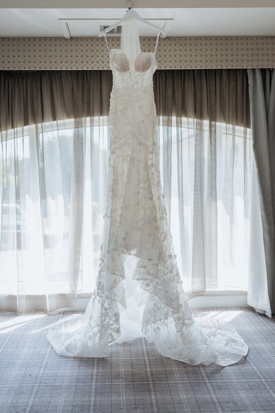 Wedding dress hung at Peak Edge Hotel Wedding Venue
