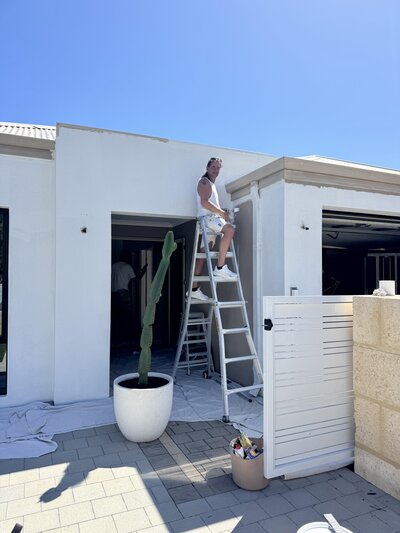 Wooden pool house with large glass windows being renovated