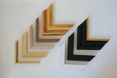 samples of picture frame moulding available for custom artwork