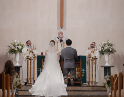 a groom kissing his bride