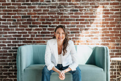 Elizabeth smiling on couch