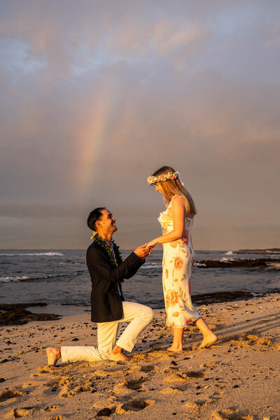 Proposal on beach at Four Seasons Hualalai taken by hawaii engagement photographer