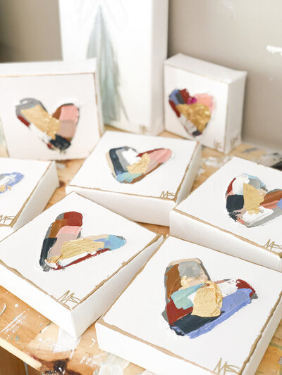 Small heart paintings by Miriam, available for purchase in the shop