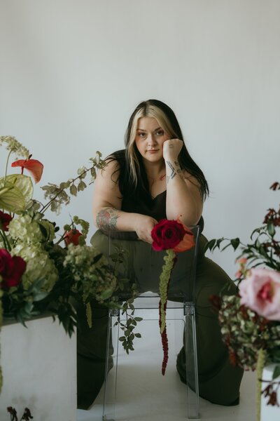 Photographer brand photo in a studio with flowers