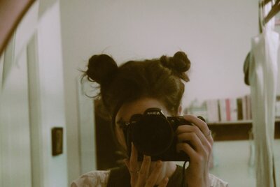 woman with space buns hairstyle takes selfie in maryville, tennessee