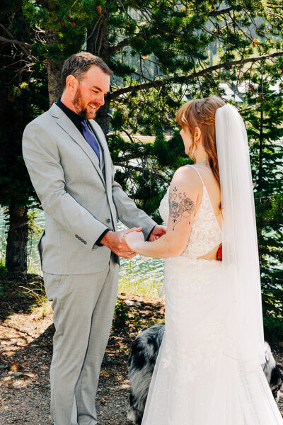 First look between bride and groom at Lake Levinsky in Big Sky, MT