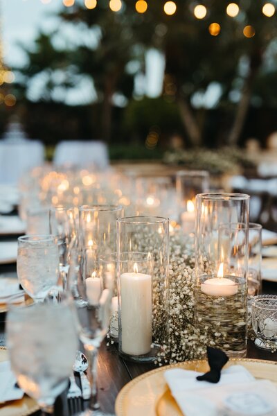 Wedding tablescape with baby's breath and pillar candles