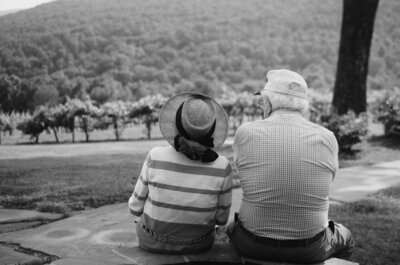 Elderly couple sitting at a lake