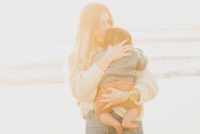 Family Photographer,  close up of mother holding young baby