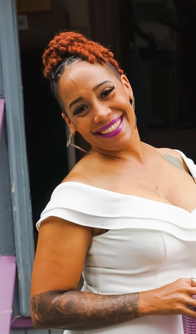 Therapist Vanessa Sujey smiling in a white top.