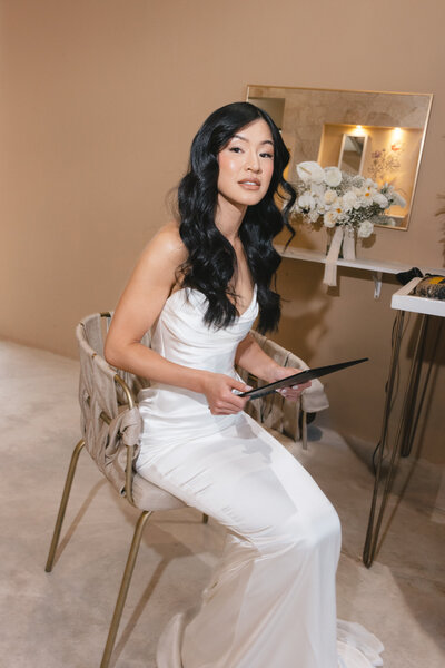 Bride posing in front of her getting ready suite