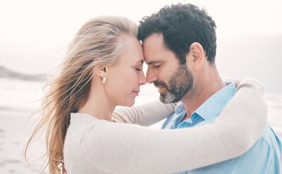 Loving couple hugging in forgiveness after infidelity. Our team of affair recovery experts helps couples in the aftermath of infidelity heal and rebuild trust.You can benefit from affair recovery program by Relationship Experts in the United States, Canada, the UK, and worldwide. Schedule a free consultation to start healing.
