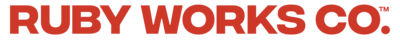 Bold, all-caps red text displaying 'Ruby Works Co.™' in a strong, modern font. This branded typography reflects the agency’s confident, strategic, and results-driven approach to branding, web design, and digital marketing for small businesses and creative professionals."