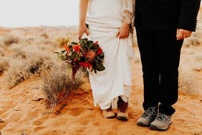 Elopement bride groom portraits showing their hiking boots