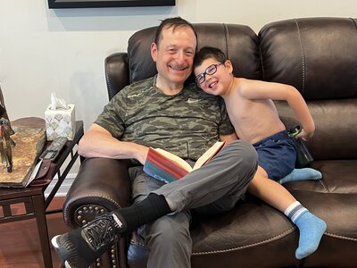 Boys on couch, uncle and nephew, reading book, adoption agencies near me, high school pregnancy, adopt my baby, in college and pregnant, new york