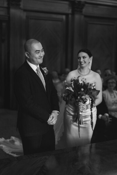 Wedding photographer captures couple taking a stroll hand in hand at their french chateau wedding.