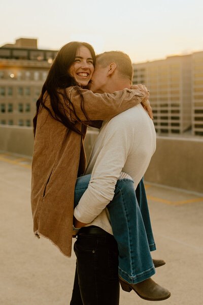 man holds wife on parking garage atlanta georgia