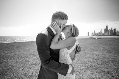 Photo of bride and groom embracing outdoors during their wedding, photographed at Chicago IL Lakefront by Kesha Wright