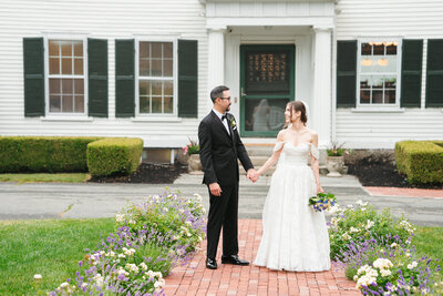 couple getting portraits done after getting married 